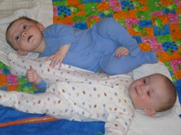 Andrew and Ryan hold the other's leg