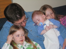 Daddy asleep with kids